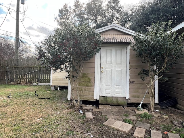 view of shed with fence