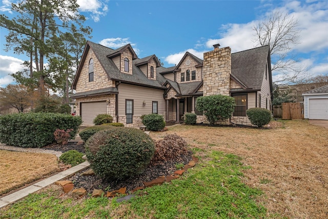 view of front of property with a garage and a front lawn