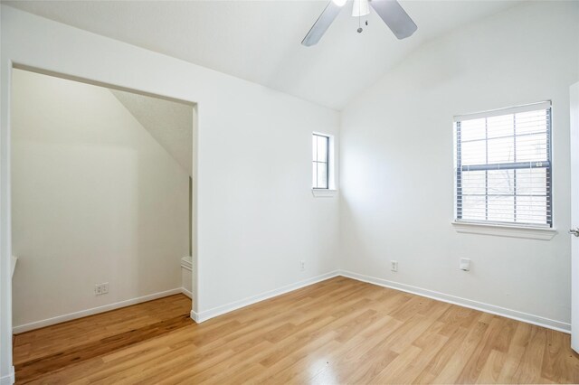 unfurnished room featuring ceiling fan, lofted ceiling, and light hardwood / wood-style flooring