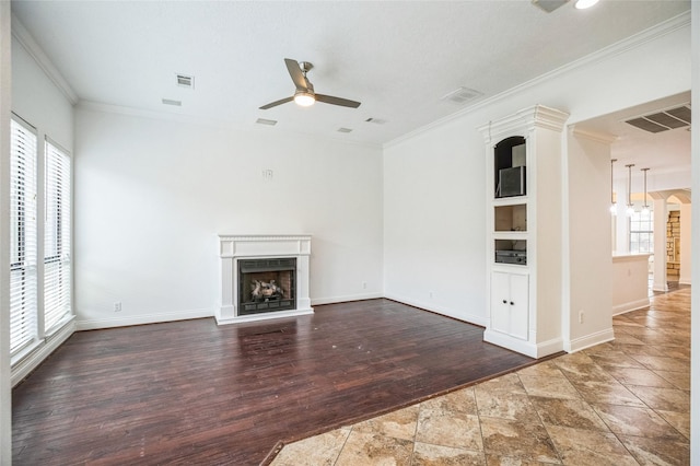 unfurnished living room with crown molding, ceiling fan, and dark hardwood / wood-style flooring