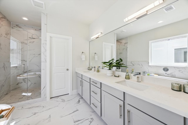 bathroom with visible vents, a sink, and a marble finish shower