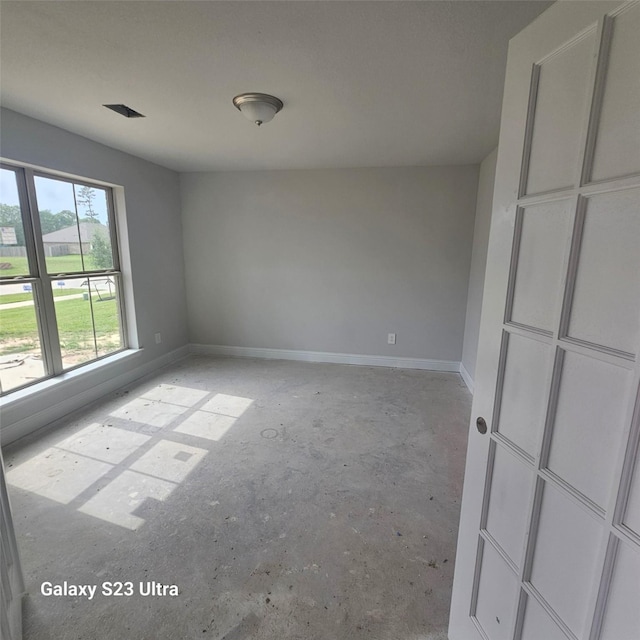 4310 Karam Lndg, Dickinson, TX 77539 - empty room with baseboards and unfinished concrete flooring