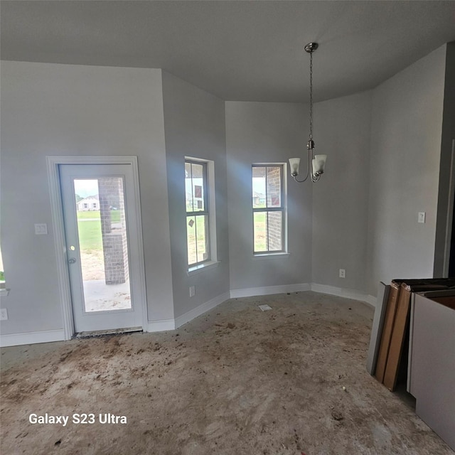 4310 Karam Lndg, Dickinson, TX 77539 - unfurnished dining area featuring a chandelier and baseboards