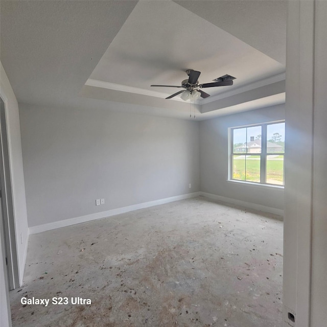 4310 Karam Lndg, Dickinson, TX 77539 - empty room with a raised ceiling, baseboards, and a ceiling fan