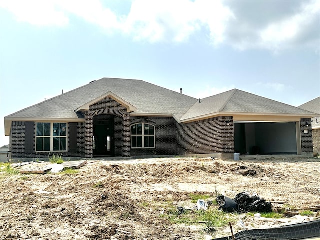 4310 Karam Lndg, Dickinson, TX 77539 - french provincial home with a garage, brick siding, and a shingled roof