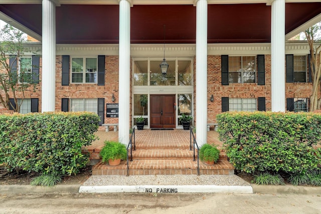 2824 Briarhurst Dr Unit 30, Houston, TX 77057 - doorway to property with a porch and brick siding
