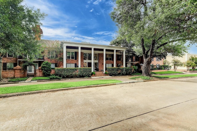 2824 Briarhurst Dr Unit 30, Houston, TX 77057 - view of front of house featuring brick siding and covered porch