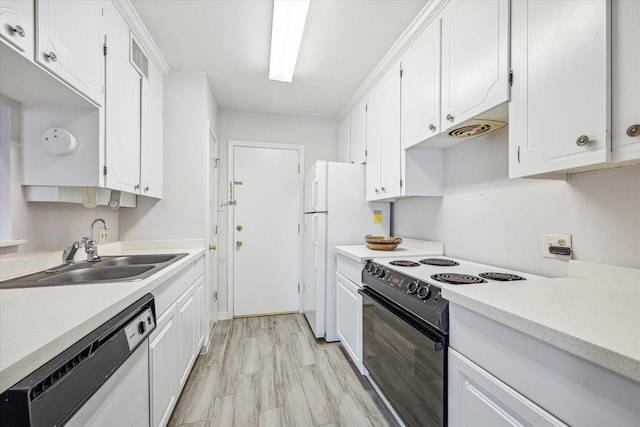 kitchen with sink, white cabinets, dishwashing machine, black range with electric cooktop, and light wood-type flooring