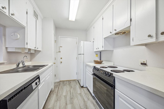 2824 Briarhurst Dr Unit 30, Houston, TX 77057 - kitchen featuring white appliances, light wood-style floors, light countertops, white cabinetry, and a sink
