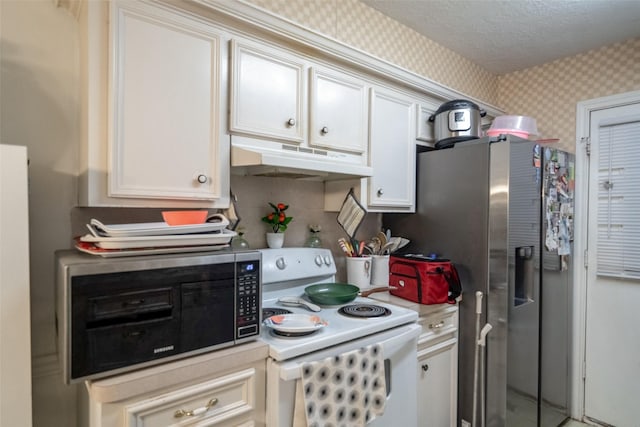 kitchen featuring stainless steel refrigerator with ice dispenser, a textured ceiling, and white range with electric stovetop