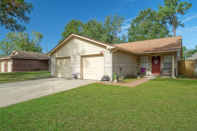 single story home featuring a garage and a front yard