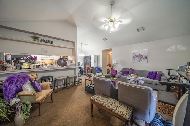 carpeted living room featuring ceiling fan with notable chandelier and vaulted ceiling