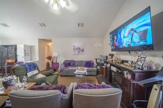 carpeted living room featuring lofted ceiling and ceiling fan