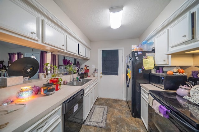 kitchen with white cabinetry, sink, black appliances, and a textured ceiling