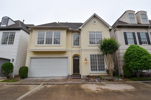 multi unit property featuring a garage