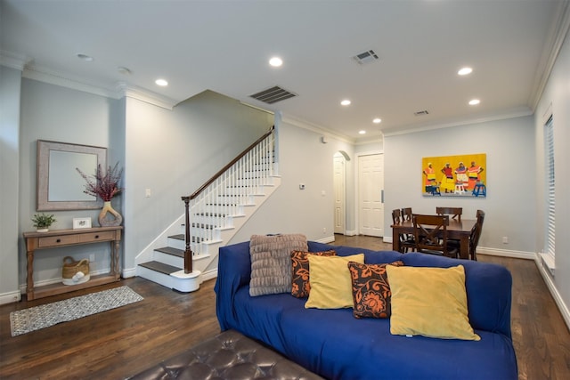 living room with dark hardwood / wood-style flooring and ornamental molding