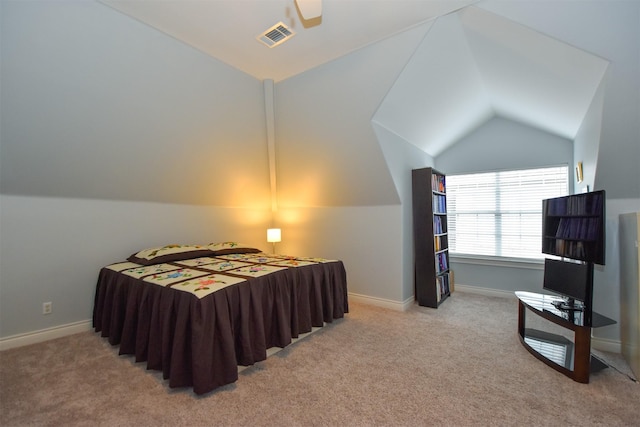 bedroom with lofted ceiling, light colored carpet, and ceiling fan