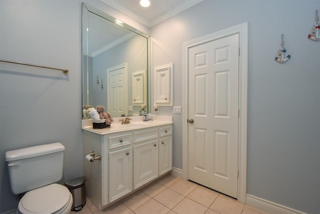 bathroom with ornamental molding, vanity, tile patterned floors, and toilet