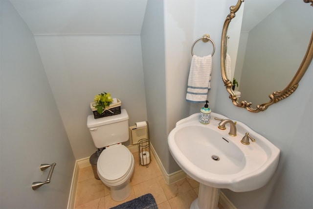 bathroom with sink, tile patterned floors, and toilet