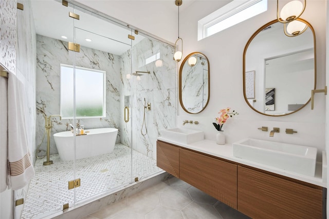 bathroom with tile patterned floors, shower with separate bathtub, and vanity