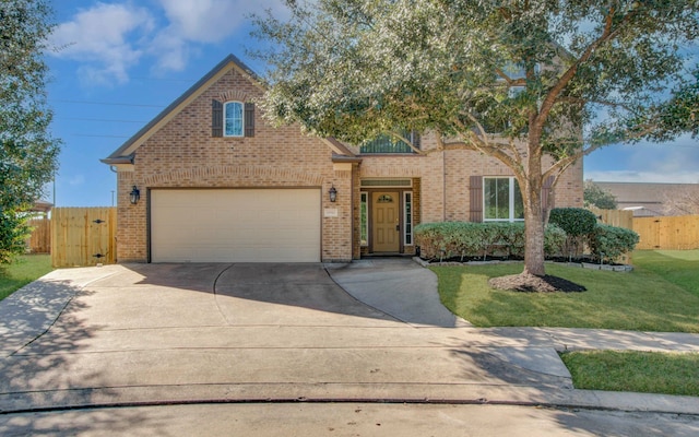 view of front facade with a garage and a front lawn