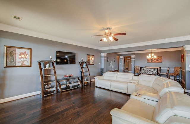 living room with decorative columns, crown molding, dark hardwood / wood-style floors, and ceiling fan with notable chandelier