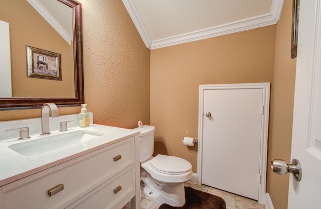 bathroom featuring ornamental molding, vanity, tile patterned floors, and toilet