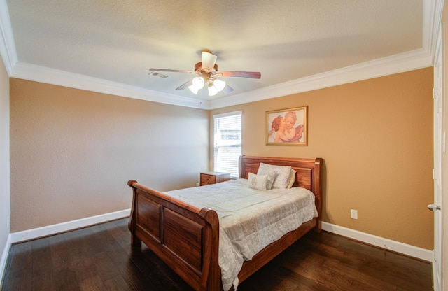 bedroom featuring dark wood-type flooring, ceiling fan, and ornamental molding