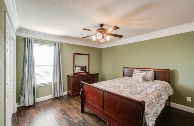 bedroom with ceiling fan, ornamental molding, dark hardwood / wood-style floors, and a textured ceiling