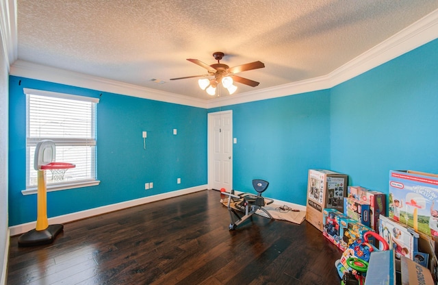 recreation room with hardwood / wood-style flooring, ornamental molding, and ceiling fan