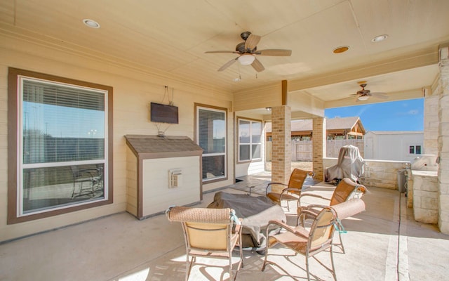 view of patio featuring ceiling fan