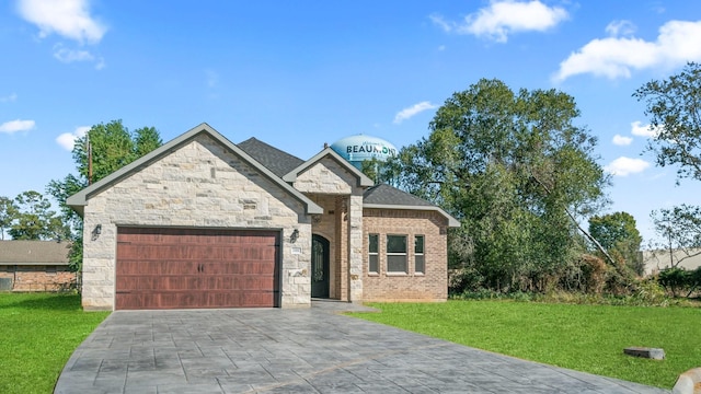 view of front of home featuring a garage and a front lawn