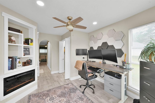 office featuring ceiling fan and light hardwood / wood-style floors