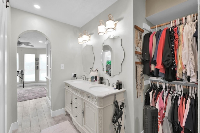 bathroom featuring vanity and ceiling fan