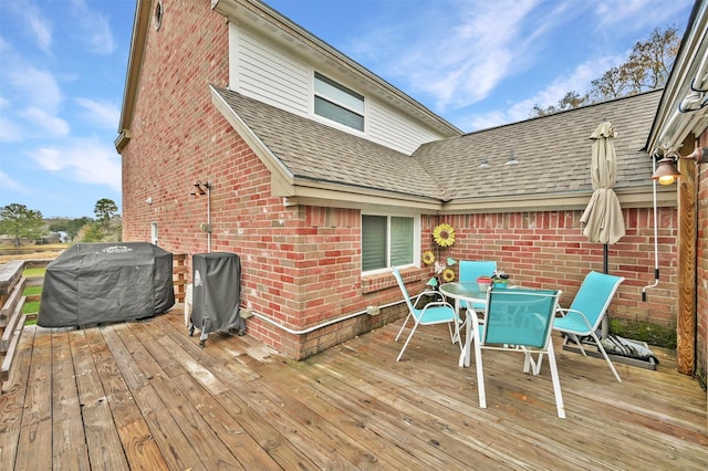 wooden deck featuring area for grilling