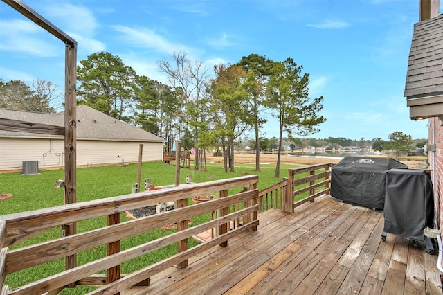 deck with central AC, grilling area, and a lawn