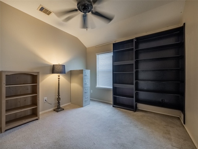 unfurnished bedroom with lofted ceiling, light carpet, and ceiling fan