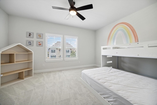 unfurnished bedroom featuring ceiling fan and light colored carpet