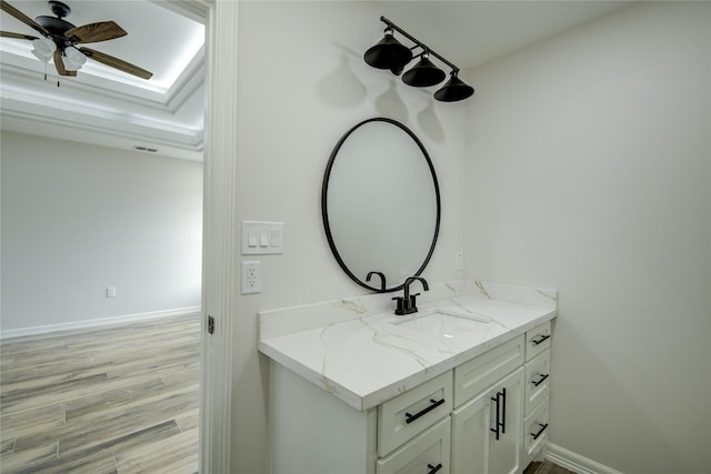 bathroom with vanity, wood-type flooring, and ceiling fan