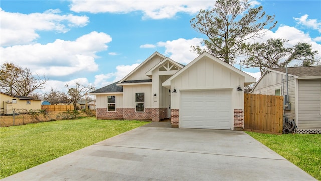 view of front of house with a garage and a front yard