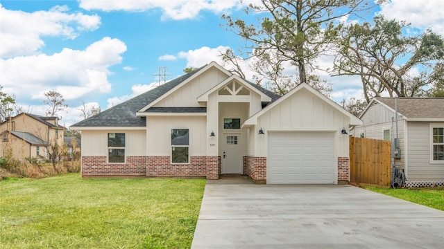 view of front of house featuring a garage and a front lawn