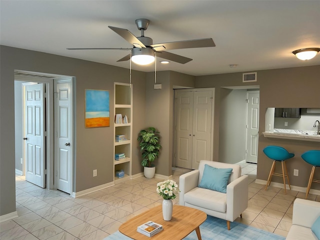 living room featuring ceiling fan