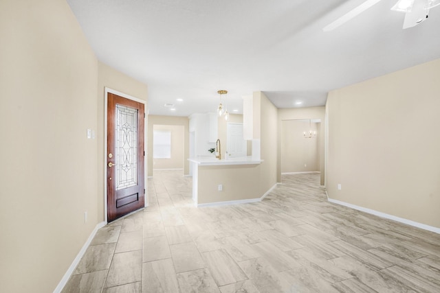 entryway featuring an inviting chandelier