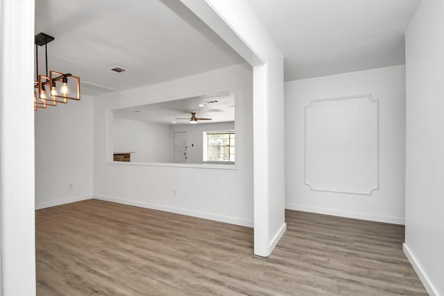 unfurnished room with hardwood / wood-style flooring and ceiling fan