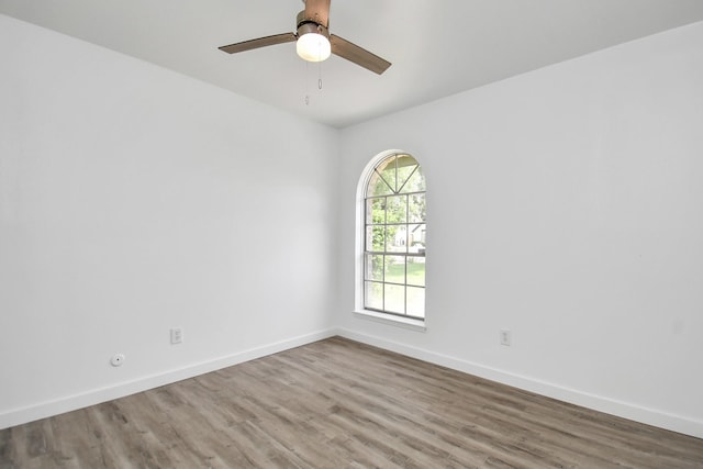 unfurnished room featuring hardwood / wood-style floors and ceiling fan