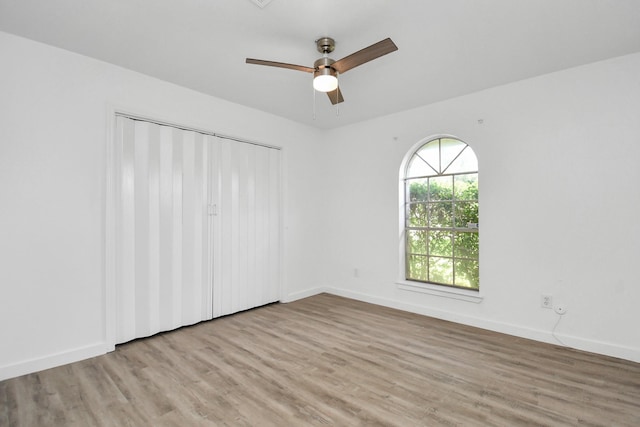 unfurnished room with light hardwood / wood-style floors and ceiling fan