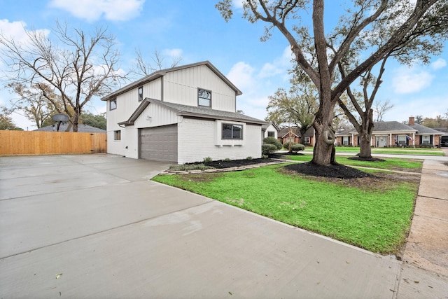 view of side of property with a garage and a yard