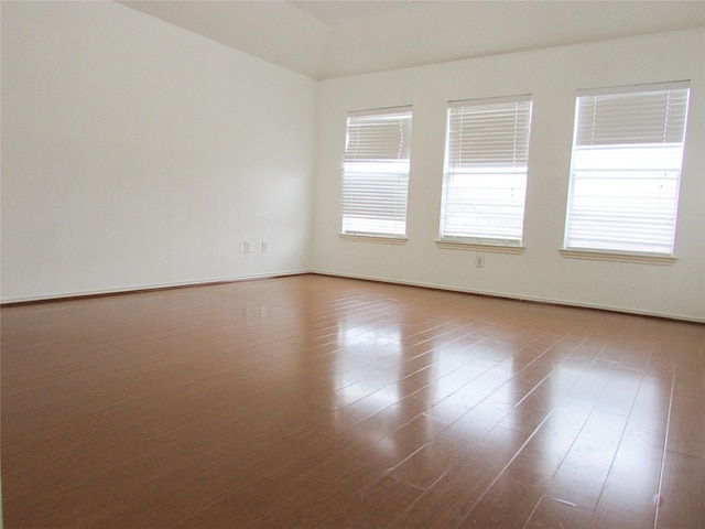 unfurnished room featuring hardwood / wood-style flooring