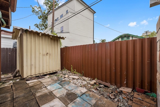 view of patio with a shed