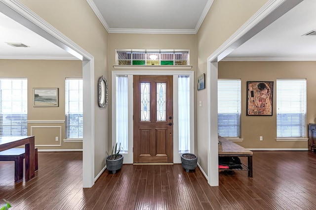 foyer entrance featuring crown molding and dark hardwood / wood-style flooring